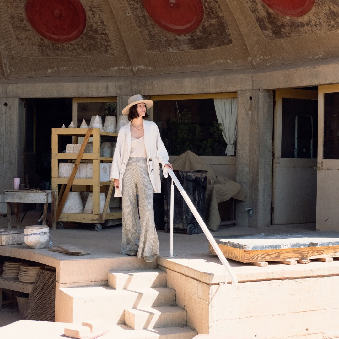 Lucette looking at the pottery in Arcosanti