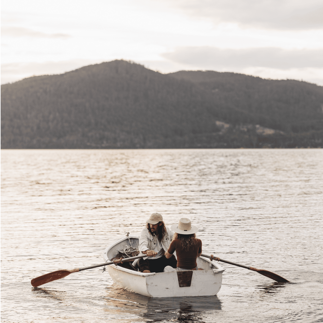 Lauren and Alex on a rowboat in Tasmania