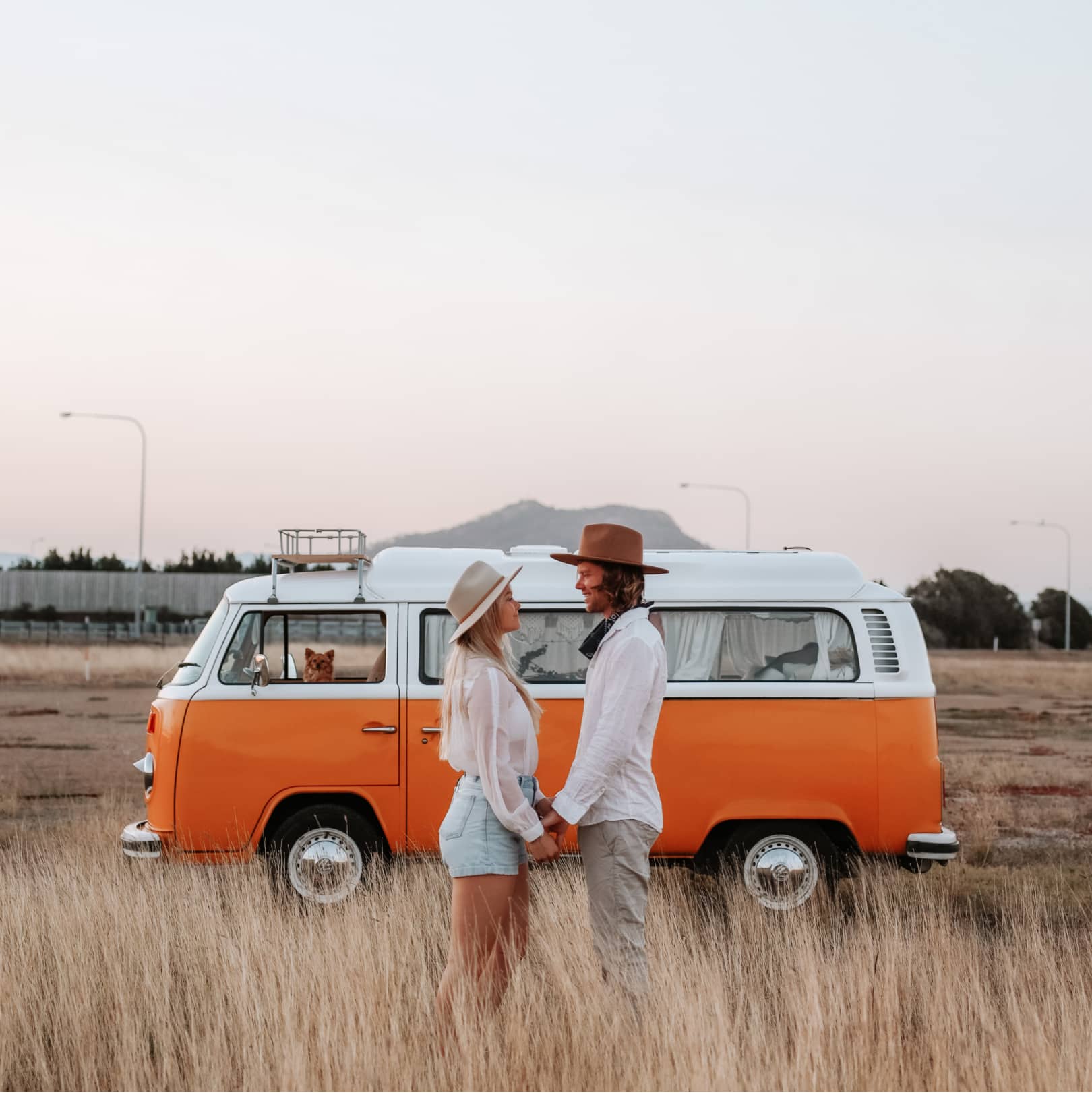 Mattea and Jordy standing in front of their van Stella