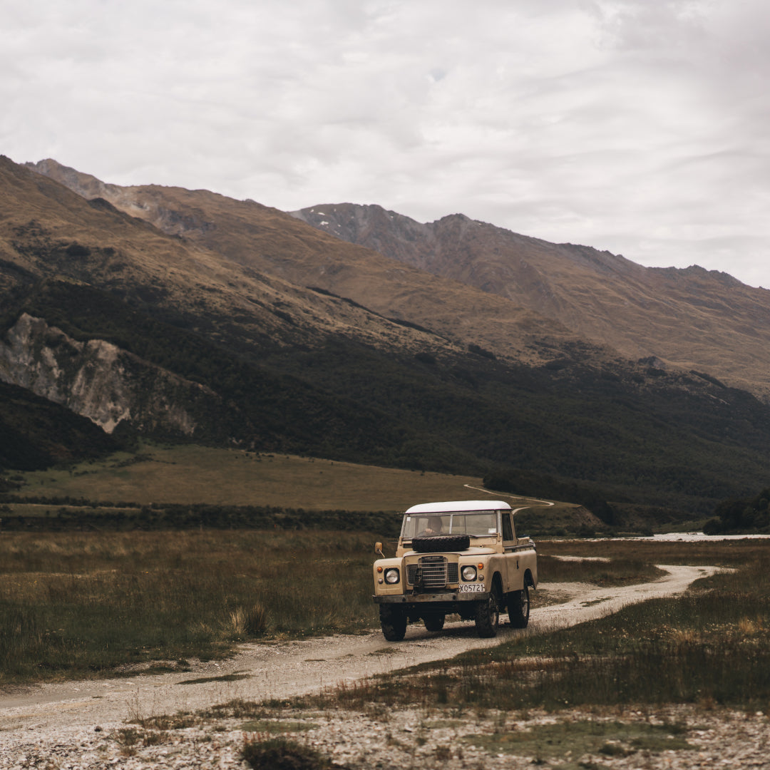 The Land Rover driving through a valley in New Zealand