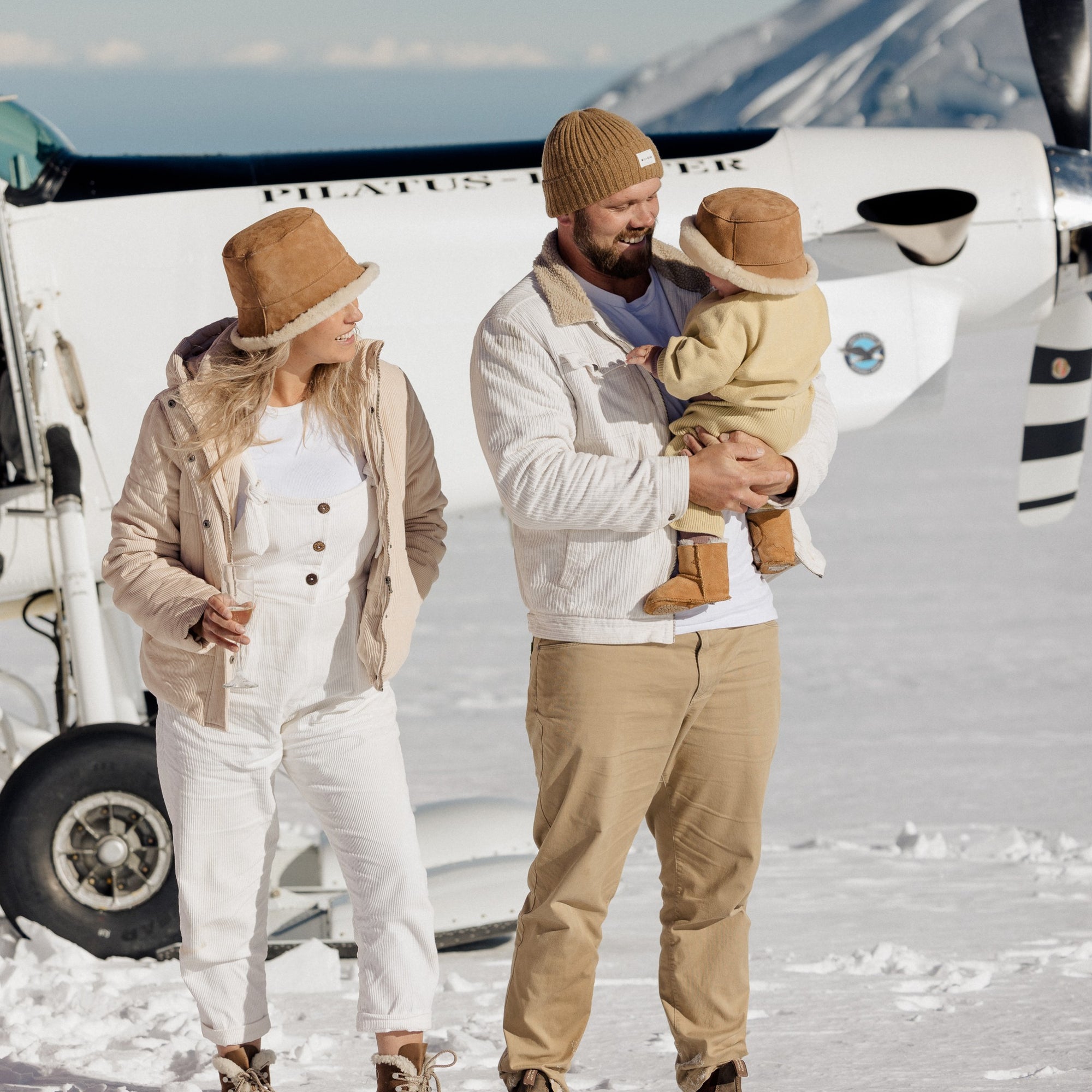 Family wearing bucket hats on a glacier