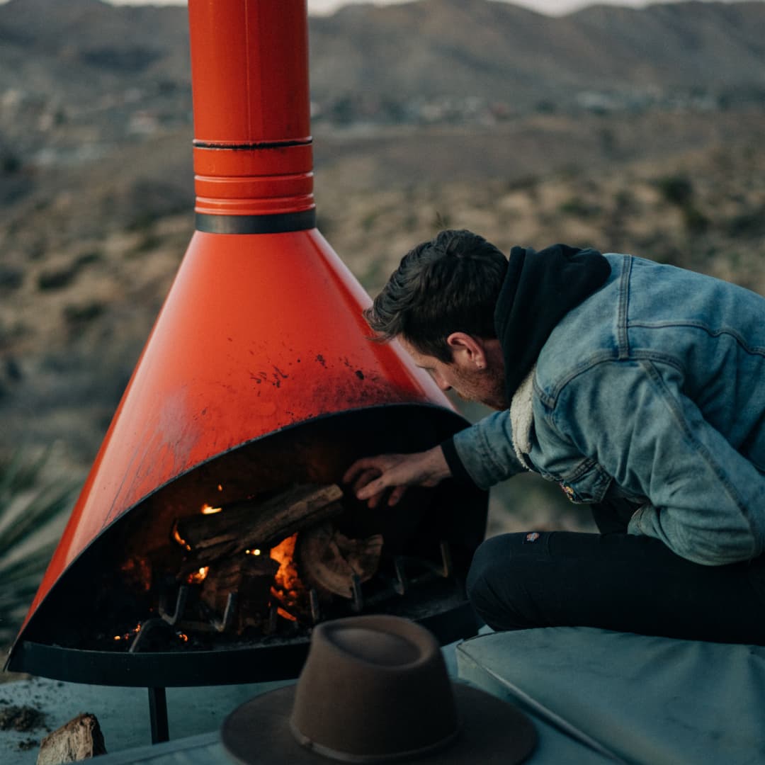 William setting up the fire at his Air bnb in Joshua Tree