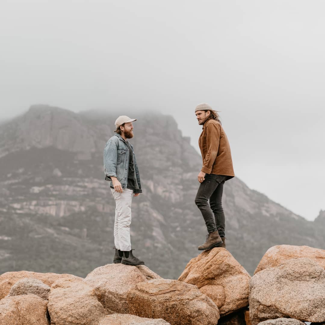 Two men exploring the rocky landscape of Swansea, Tasmania
