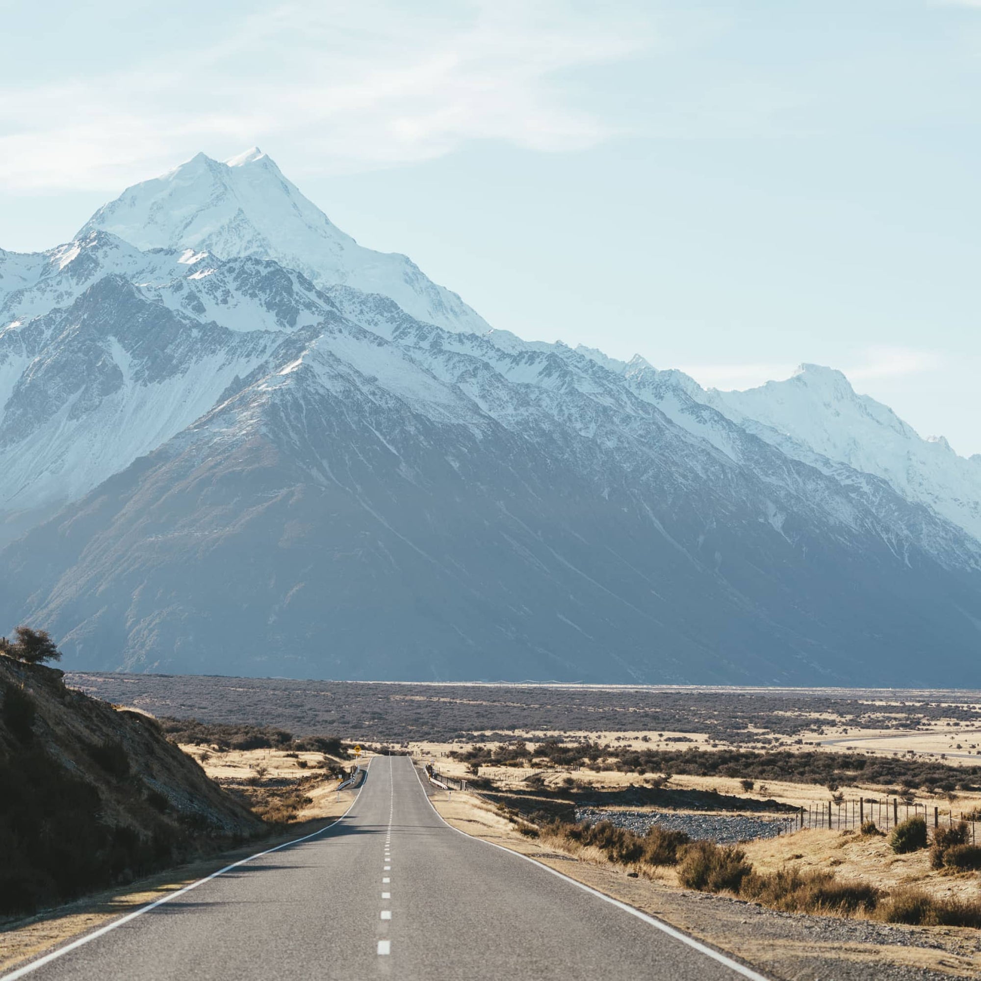 Landscape photo of a road going through Hooker Valley in New Zealand