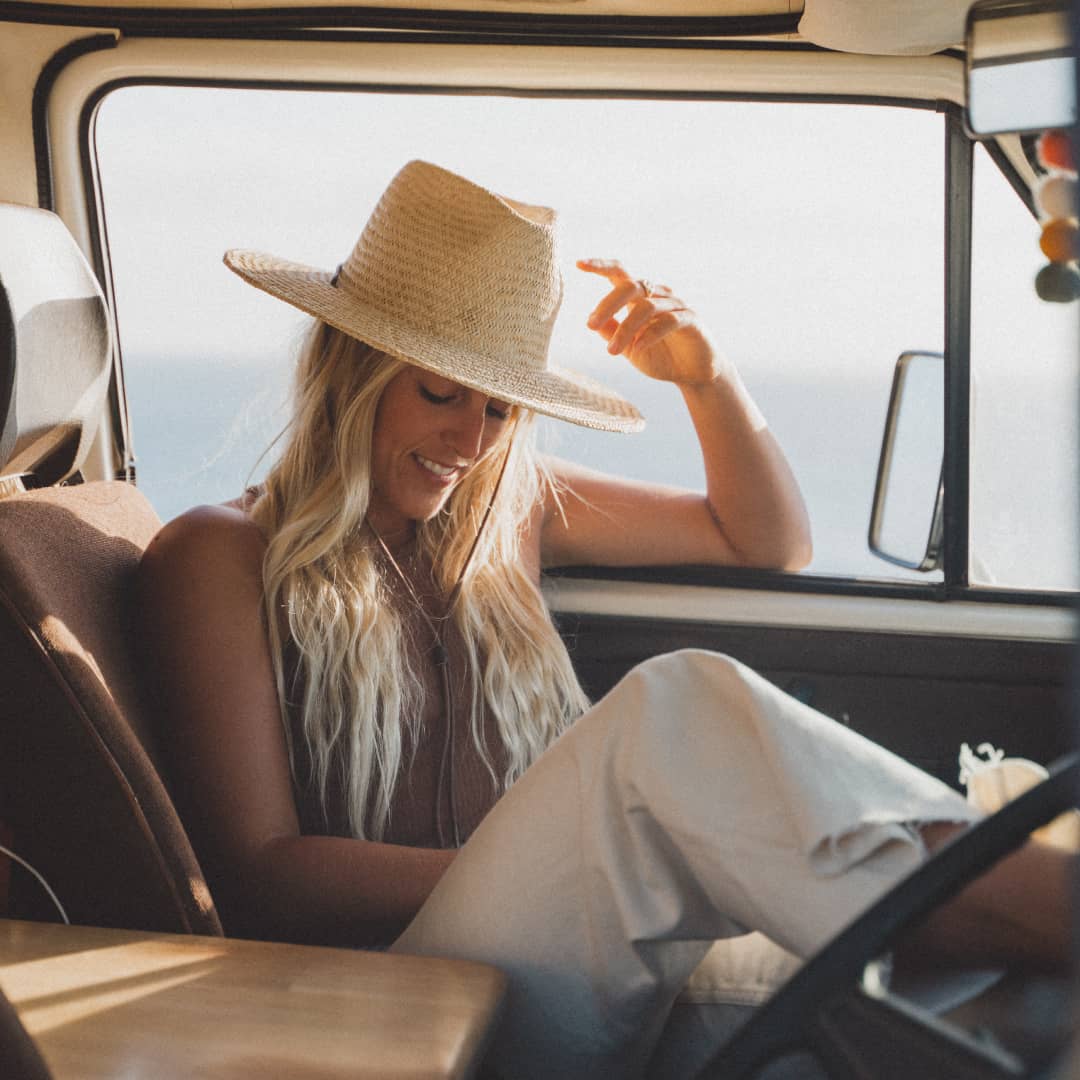 Kendall sitting in the passenger seat of her van