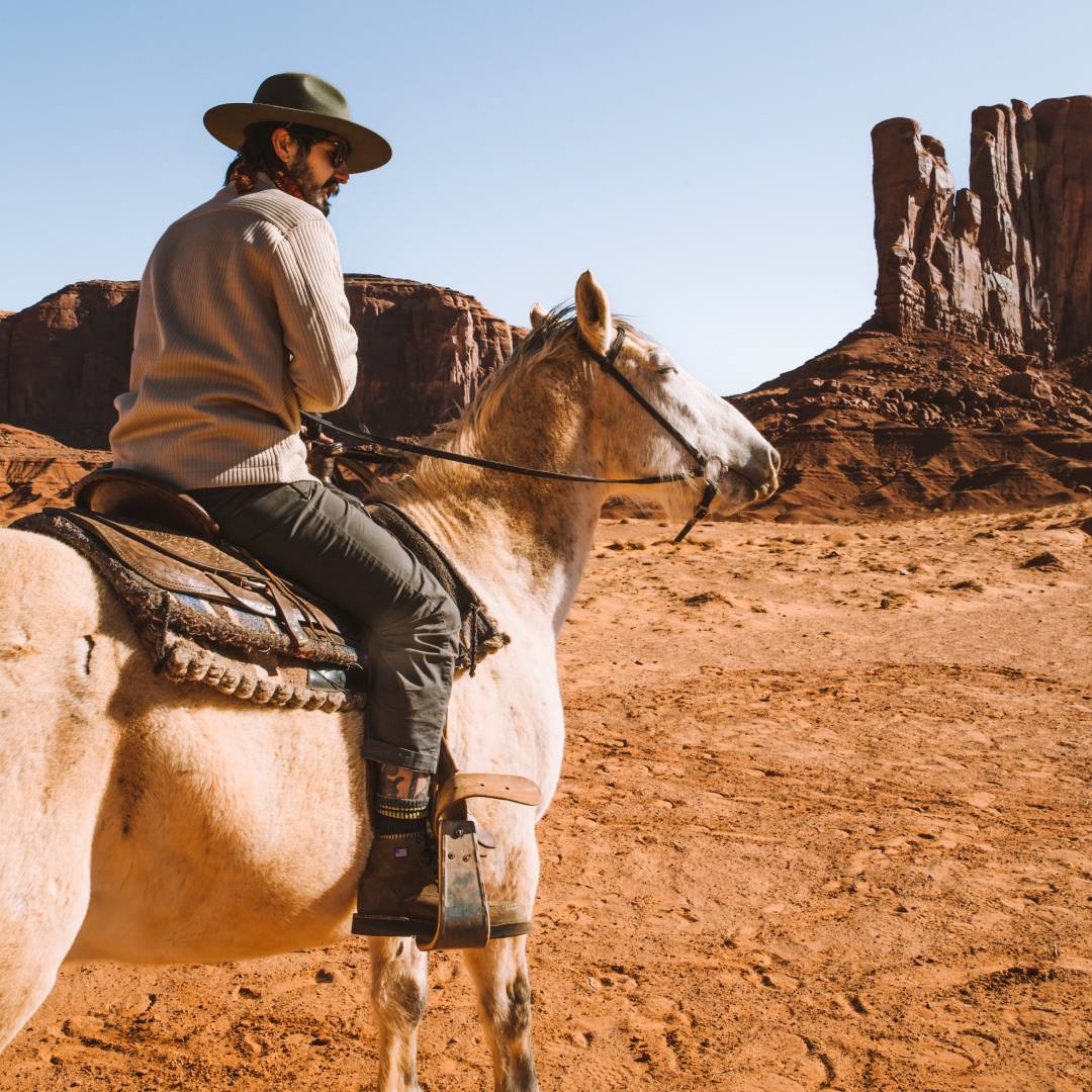Rod riding a horse through the Utah desert