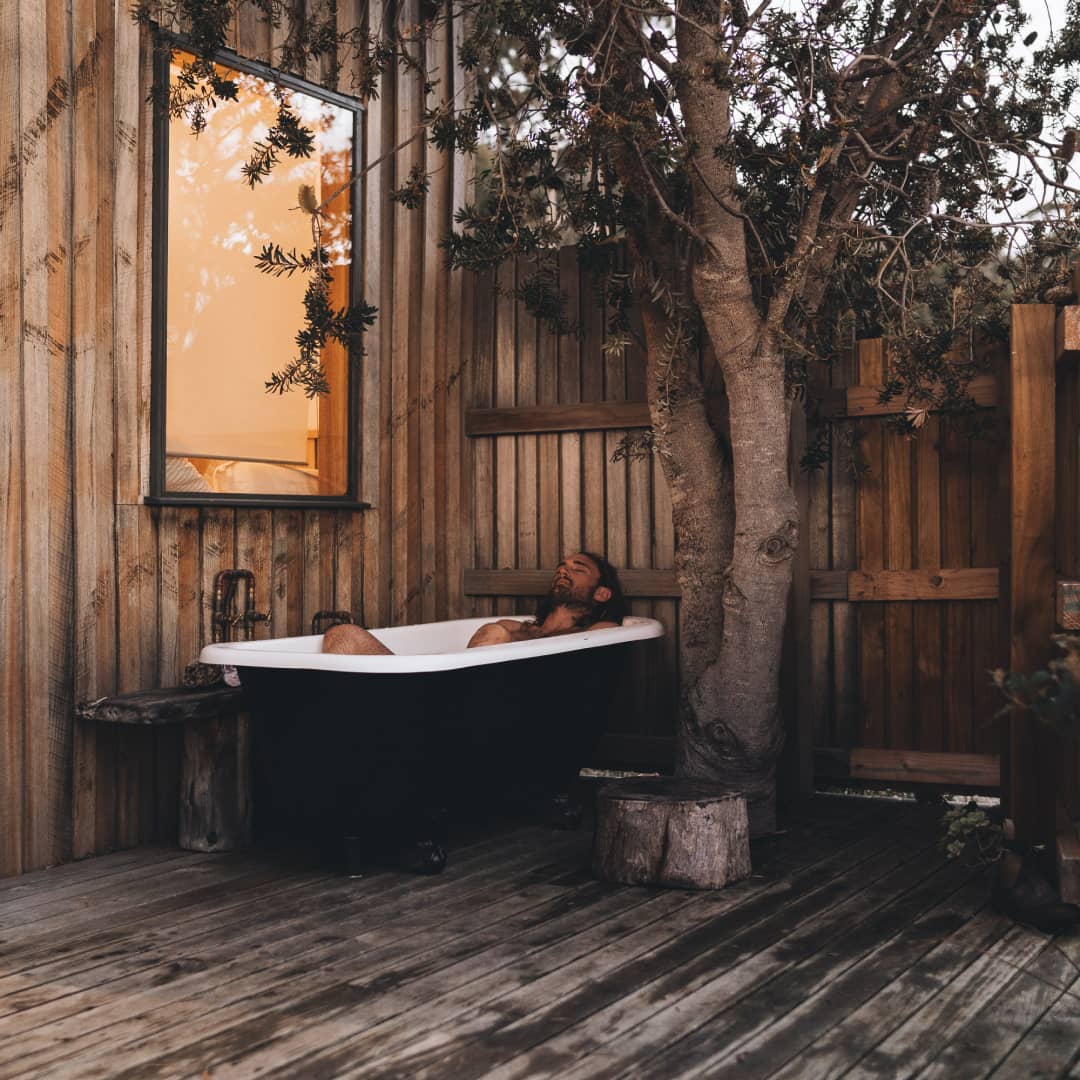 Alex having a soak in the outdoor bath