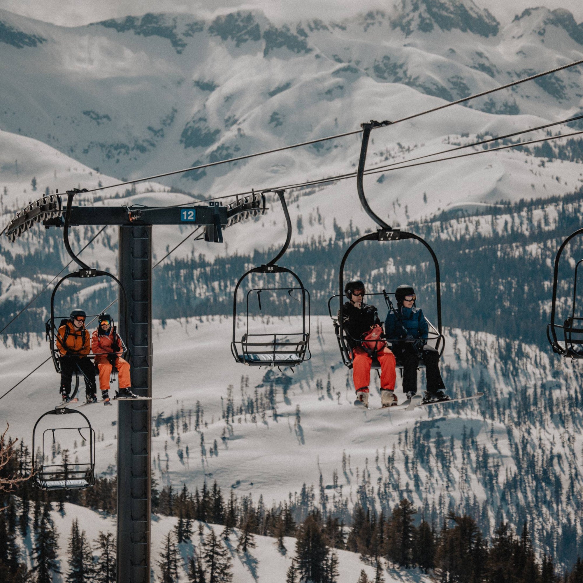 Skiiers on a chair lift