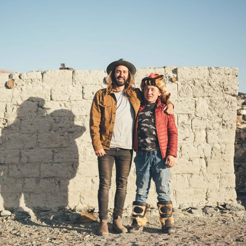 Stefan standing next to a local in Mongolia