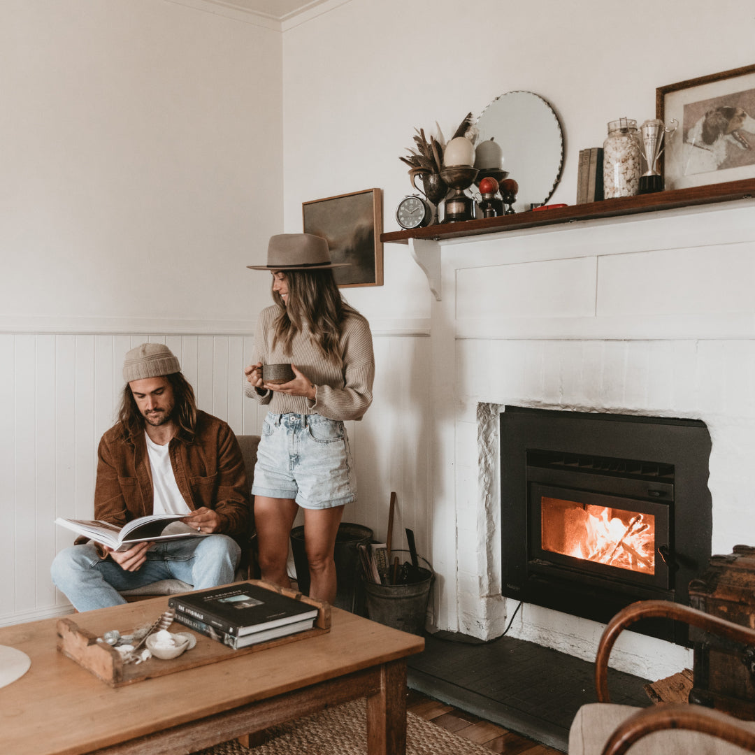 Alex and Lauren sitting by the fireplace