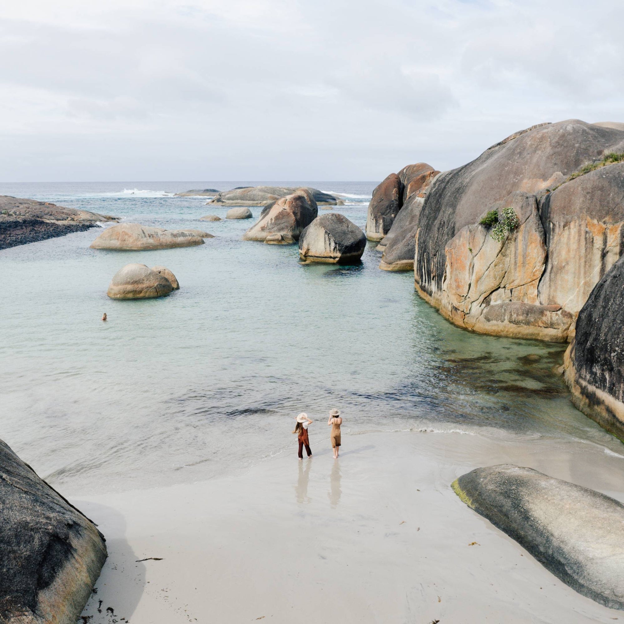 Rachel and her friend stand in the shallow water at Elephant Rocks Greens Pool