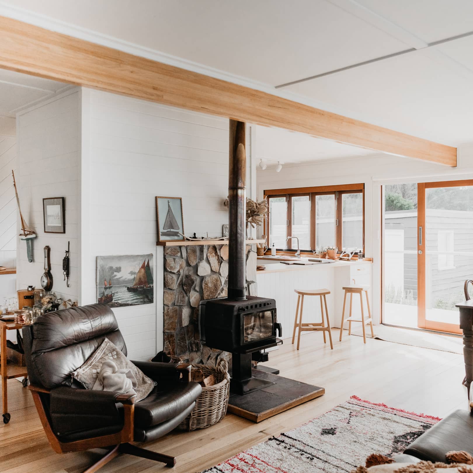 Fireplace and couch inside the living area of a beach shack