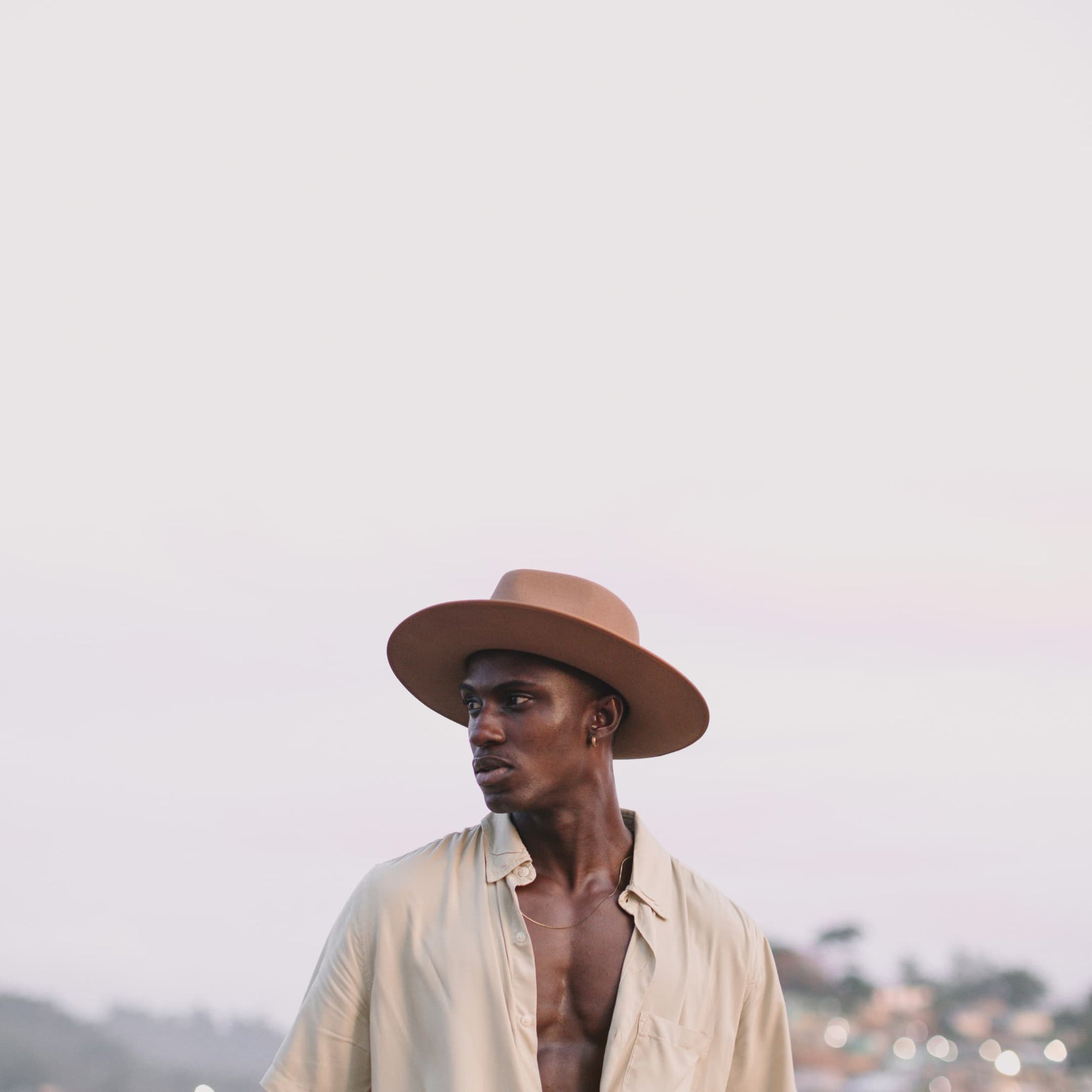 A man wearing a wide brim wool hat in Ghana